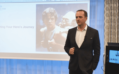 A photo of Samuel Cook presenting at a conference.