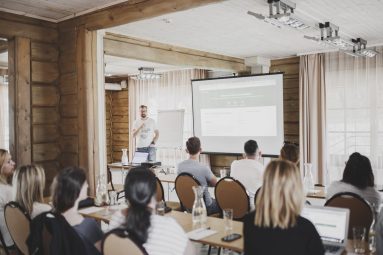 A photo of ScholarshipOwl CEO David Tabachnikov leading a summit.